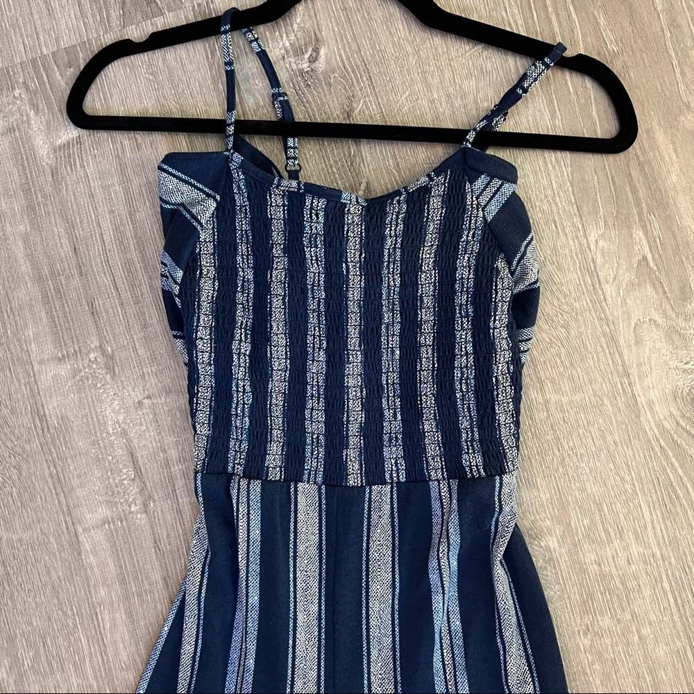 Blue striped jumpsuit. New without tags. Size small.